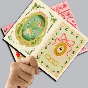 Detail of vintage artist illustration scrapbooking papers with mermaid and floral patterns