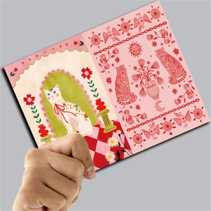 Detail of vintage artist illustration card featuring a white cat and floral tiger patterns