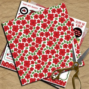 Detail of vintage ladybug scrapbooking paper with floral patterns and craft scissors