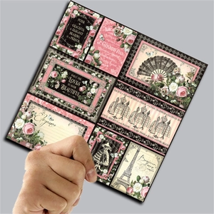Close-up of vintage collage scrapbooking paper with elegant floral and Eiffel Tower designs