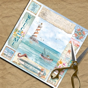 Close-up of nautical scrapbooking paper with lighthouse, sailboat, and seashell motifs