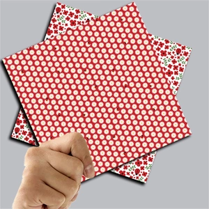 Detail of vintage ladybug and floral pattern craft paper for DIY scrapbooking projects