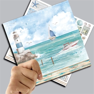 Detail of square vintage nautical scrapbooking paper with lighthouse and shell patterns