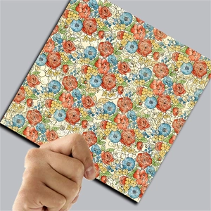 Detail of floral collage paper with vintage red and blue patterns for scrapbooking scrap