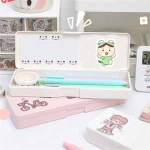 Detailed view of pink and white plastic pencil boxes with cute cartoon character prints