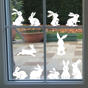 Lot de 11 stickers de Pâques lapins blancs statiques aux poses variées pour vitres et fenêtres