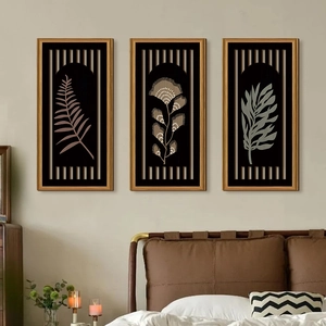 Detailed close-up of a set of 3 botanical wall art pieces with elegant gold frames