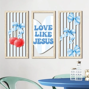 Detail of three-piece bohemian wooden wall art featuring pink bows and Love Like Jesus text