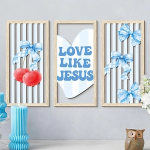 Detail of three-piece bohemian wooden wall art set with pink bows and Love Like Jesus text