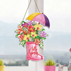 Detail of wooden Hello Spring sign with floral rain boots and rustic hanging twine