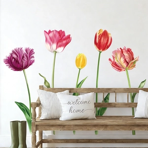 Detail of colorful tulip wall decals on a white wall above a wooden bench