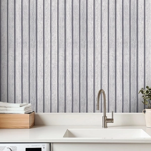 Detailed view of light gray vertical wood grain texture self-adhesive wall paneling