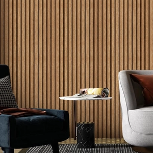 Close-up of vertical wood grain wall panels behind a modern living room sofa set