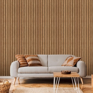 Detailed view of modern light brown vertical wood slat wall panels in a cozy living room