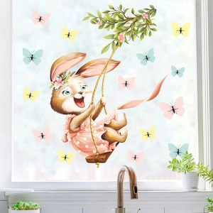 Detailed view of Easter bunny window sticker on glass with floral swing and butterflies