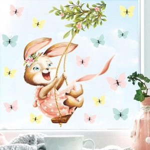 Easter bunny swinging on a window with colorful butterflies stickers for home decor