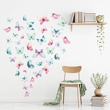 Detailed view of watercolor butterfly wall stickers in a minimalist Nordic living room decor
