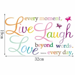 Detail of colorful Live Laugh Love wall stickers with inspirational text and butterflies