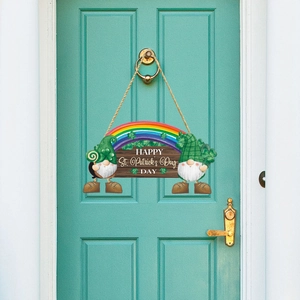 Detail of wooden St. Patrick's Day door hanger featuring gnomes and a colorful rainbow