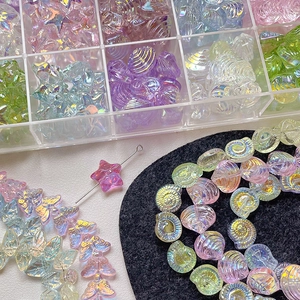 Iridescent ocean-themed DIY beads set featuring stars and shells in a clear storage box