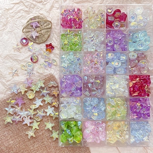 Macro shot of 24-compartment storage box with assorted iridescent ocean-themed glass beads