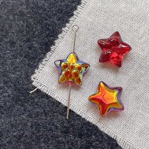 Close-up of 10mm iridescent star glass beads for DIY jewelry making with smooth texture