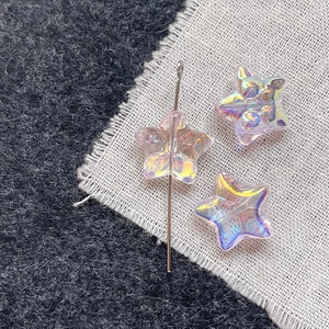 Macro detail of star-shaped aurora glass beads with colorful iridescent coating