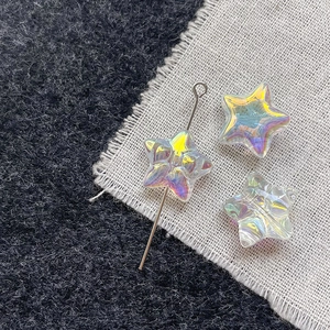 Macro detail of aurora star glass beads with iridescent coating for DIY jewelry