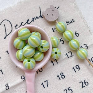 Detail of colorful striped acrylic round beads for DIY handmade jewelry and phone chains