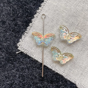 Close-up of iridescent butterfly glass beads for DIY jewelry with AB coating finish