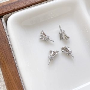 Macro detail of silver plated bead caps with pavé cubic zirconia for DIY jewelry