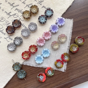 Handcrafted Czech glass Hawaiian plum blossom beads with gold accents in vintage colors