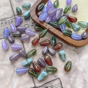 Handmade teardrop glass beads with gold stripes for DIY jewelry making in vintage colors