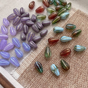 Macro shot of striped teardrop glass beads in various colors for DIY jewelry making