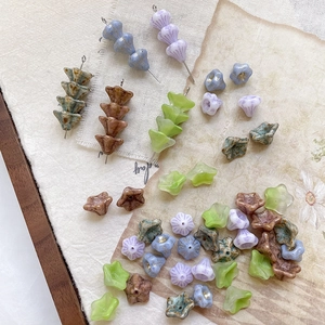 Macro shot of lily of the valley glass beads for handmade DIY jewelry crafts