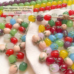 Macro detail of colorful fruit glass beads with green leaves for DIY jewelry making