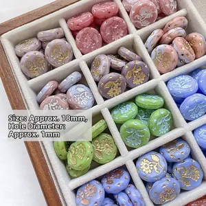 Detail of 18mm Czech glass flower beads in a wooden organizer for DIY jewelry making