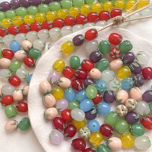 Macro shot of colorful translucent glass eggplant beads for DIY jewelry making