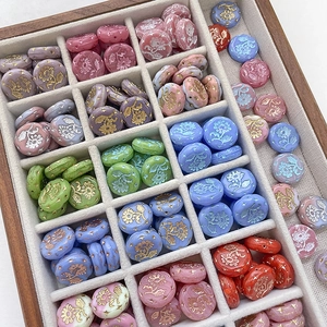 Macro view of vintage Czech glass flower beads in various colors for DIY jewelry crafts