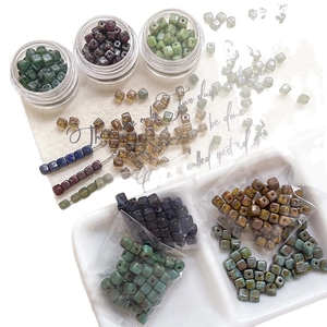 Assorted vintage Czech glass cube beads for DIY jewelry making in various retro colors