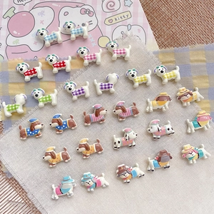 Macro shot of assorted cute resin cartoon puppy beads for DIY jewelry and crafts decoration