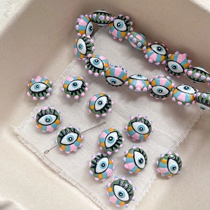 Macro detail of colorful evil eye beads with stripes for DIY jewelry making and crafting