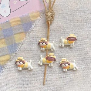 Detailed view of cute resin puppy charms with straw hats for DIY jewelry making