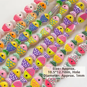 Macro shot of 19.5x12.7mm colorful fish-shaped ceramic beads for DIY jewelry making