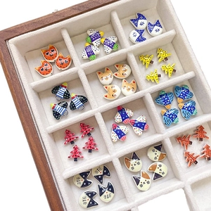 Handmade ceramic cat and tree beads set with colorful glaze finish in a wooden organizer box