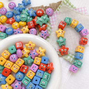 Close-up of colorful cartoon cube and star beads for DIY handmade phone strap accessories