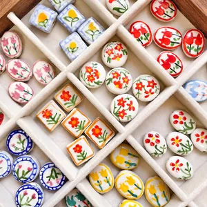 DIY ceramic flower beads with strawberry and tulip patterns in a velvet jewelry box