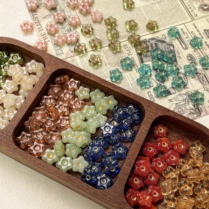 Macro detail of colorful star-shaped Czech glass beads for DIY jewelry making