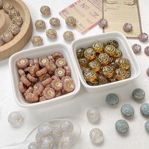 Detailed macro view of hand-painted glass rose beads for DIY jewelry making