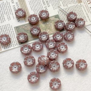 Detailed view of vintage hand-painted Czech glass rose beads for DIY jewelry making